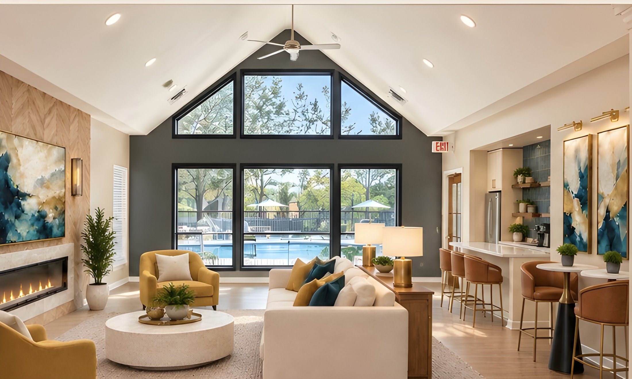 After: the lounge with a charcoal gable wall and tall black windows looking out to the pool, the herringbone fireplace wall on the left and the coffee bar on the right