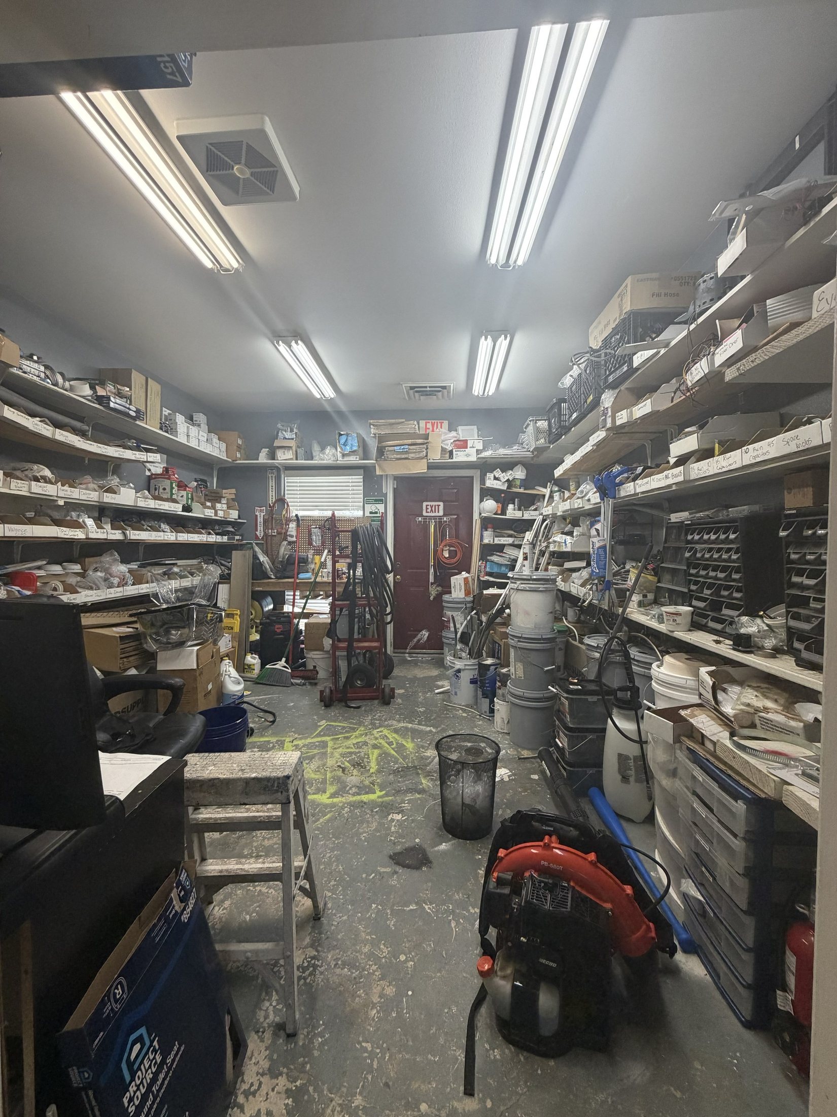 Before: a cluttered storage room with tools and supplies